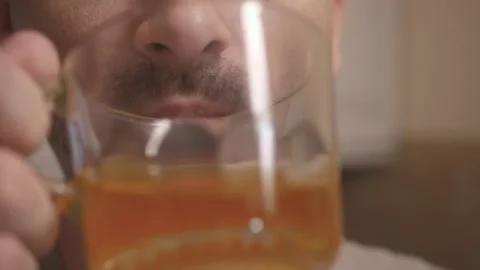 Man Relishing Beverage Stock Footage 314343200