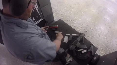 Man reloading rounds into magazine Stock-Footage 61094231