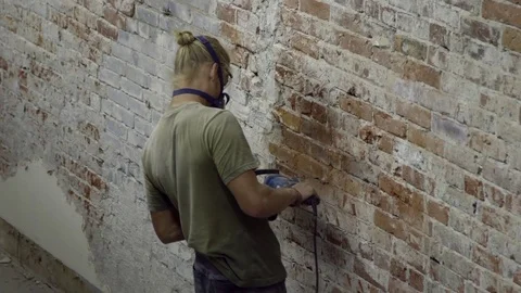 Man remodelling a brick wall Stock Footage 81043003