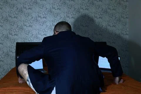 A man on remote access sits on remote access Stock Photos