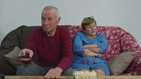 A man with a remote control in his hands is excited about his favorite team. Stock Footage 145280378