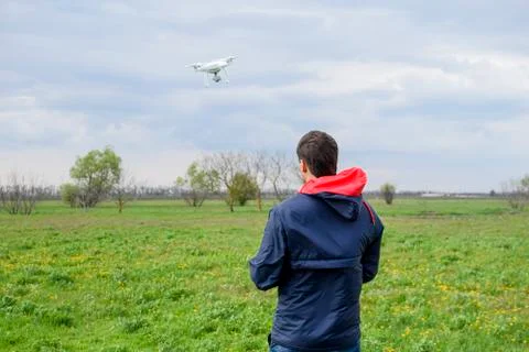 A man with a remote control in his hands. Flight control of the Stock Photos