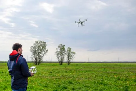 A man with a remote control in his hands. Flight control of the Stock Photos