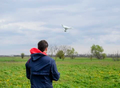 A man with a remote control in his hands. Flight control of the drone. Phantom Stock Photos