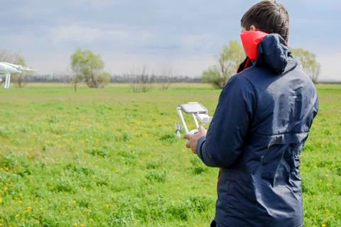 A man with a remote control in his hands. Flight control of the drone. Phantom Stock Photos