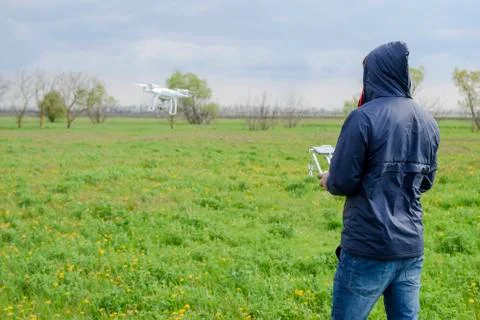 A man with a remote control in his hands. Flight control of the drone. Phantom Stock Photos