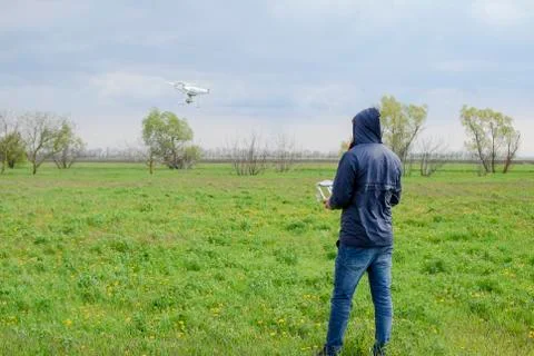 A man with a remote control in his hands. Flight control of the drone. Phantom Stock Photos