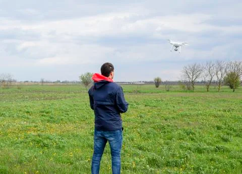 A man with a remote control in his hands. Flight control of the drone. Phantom Stock Photos