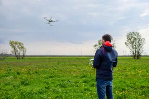 A man with a remote control in his hands. Flight control of the drone. Phantom Stock Photos