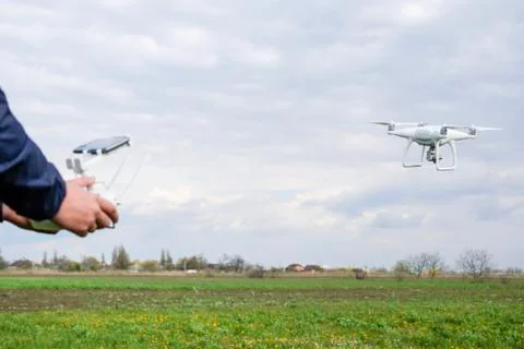 A man with a remote control in his hands. Flight control of the drone. Phantom Stock Photos