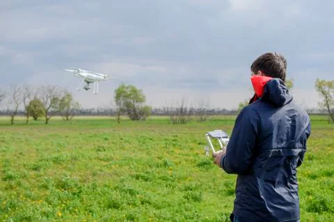 A man with a remote control in his hands. Flight control of the drone. Phantom Stock Photos