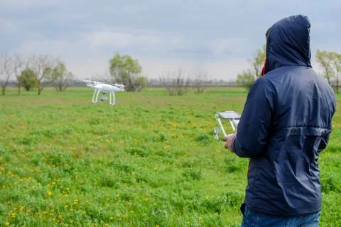 A man with a remote control in his hands. Flight control of the drone. Phantom Stock Photos