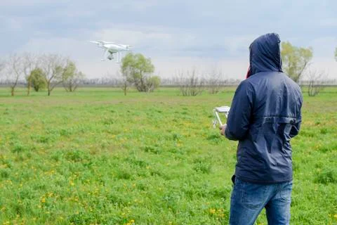 A man with a remote control in his hands. Flight control of the drone. Phantom Stock Photos