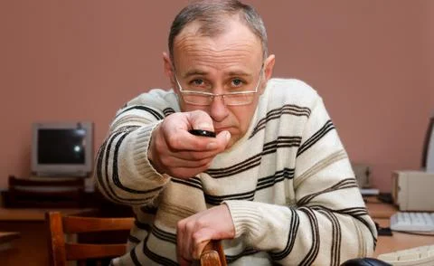 Man with remote control Stock Photos