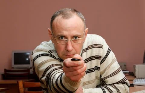 Man with remote control Stock Photos