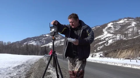 Man with remote control pult for copter drone Видео 80795385