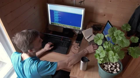 Man remote working home and drinks, candid lifestyle workplace, stay home Video stock 130494212