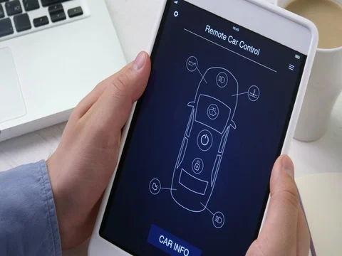 Man remotely locks his car using car remote control app on the digital tablet Stock Footage