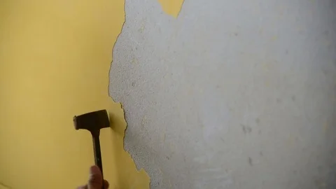 A man remove old wall cement color Stock Footage 71125180