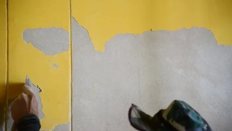 A man remove old wallpaper Stock Footage 71139313