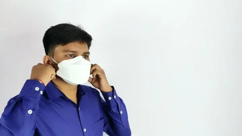 Man remove surgical face mask for easy breath Stock Footage 139097677