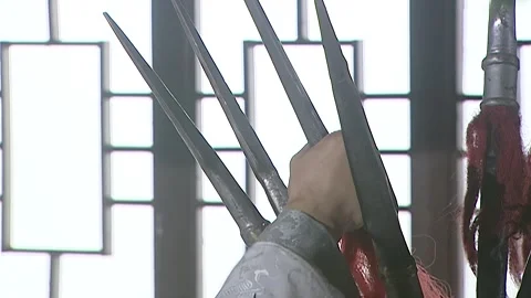 The man removed the head of the prop red tassel spear Stock Footage 276516542