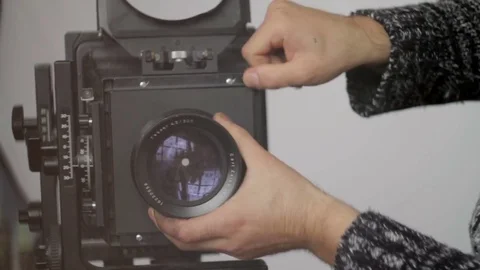 Man removes camera lens close-up Stock Footage 71614696