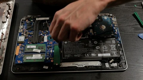 Man Removes Laptop Battery Stock Footage 101404734