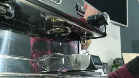 Man removes lever from coffee machine placing on bar countertop Stock Footage 306622553