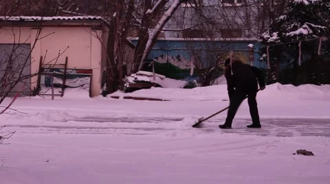 Man removes snow shovel iron Stock Footage 59144851