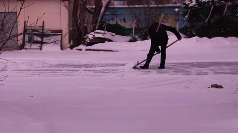 Man removes snow shovel iron  Stock Footage 59144857