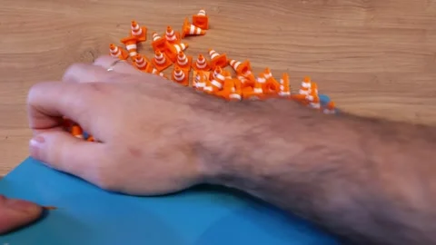 Man removing 3D printed objects from the build plate. Stock Footage 336961045
