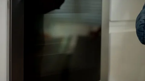 Man removing baking tray from oven. Stock Footage 64107029