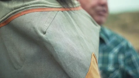 Man removing fly mask from the face of horse Stock Footage 83184438