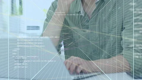 Man removing pen and starting typing on laptop with grid overlay crossing face Stock Footage 333734865