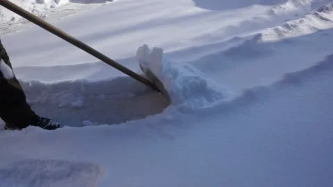 The man is removing snow after a blizzard Video stock 147958783