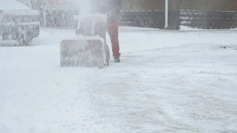 Man removing snow with snow plow machine Stock Footage 80805243