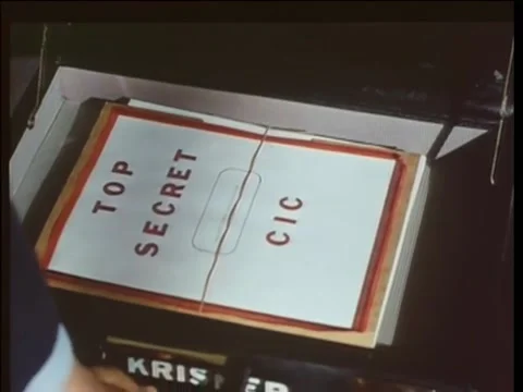 Man removing top secret documents from briefcase, 1970s Stock Footage 260257735