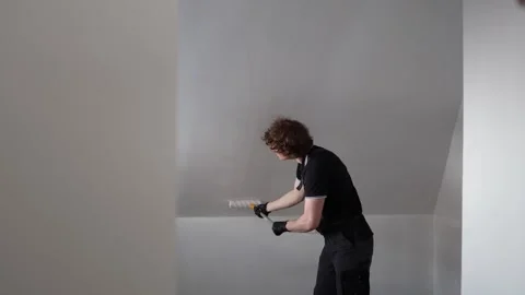 Man renovating empty attic apartment Stock-Footage 335045810