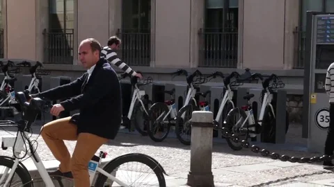 Man renting a bicycle Stock Footage 69110047