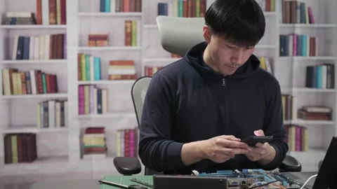 Man repairing a computer circuit board hardware for Artificial Intelligence Stock Footage 295394872