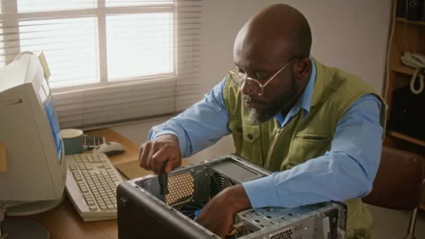 Man Repairing Desktop Computer with Screwdriver Stock Footage 341427604