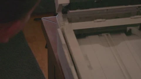 Man repairing a malfunctioning office printer Stock Footage 336950928