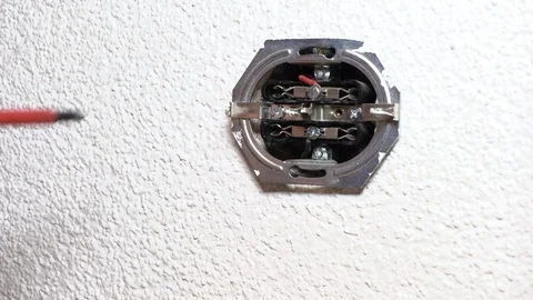 The man is repairing the outlet Stock-Footage 95129665