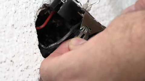 The man is repairing the outlet Stock-Footage 95151799