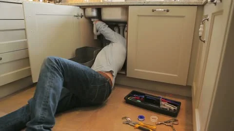 Man repairing sink Stock Footage 12283530