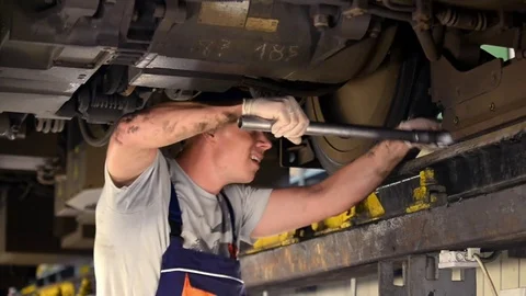 A man repairing a train Stock Footage 76297730