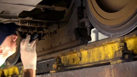 A man repairing a train Stock Footage 76297921