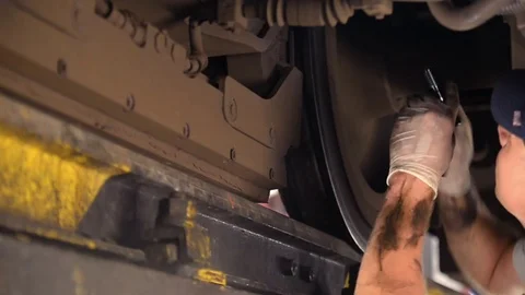 A man repairing a train Stock Footage 76388034