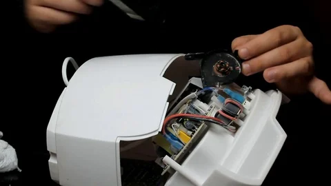 Man repairs and lubricates the cooler of technology. repair of the cooling sy Stock Footage 81673280
